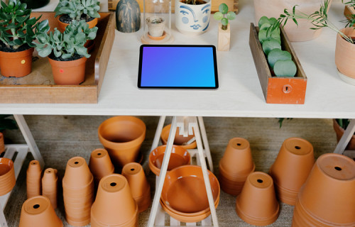 iPad Air mockup on a white table in an indoor garden
