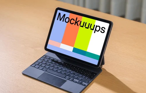 iPad Air mockup on wooden desk with keyboard