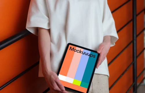 iPad Air Mockup with Woman Against Orange Wall