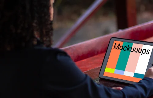 iPad Mini mockup held by female user