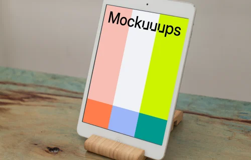 iPad Mini mockup placed on a wooden table in portrait mode