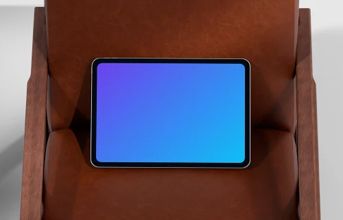 iPad Pro mockup on a leather armchair