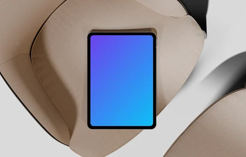 iPad Pro mockup on a modern fabric chair