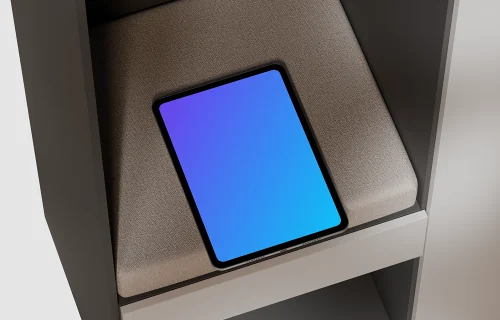 iPad Pro mockup on a textured cushion in a modern shelf