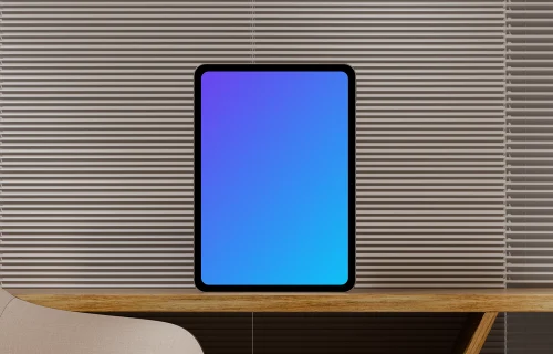 iPad Pro mockup on a wooden desk with blinds