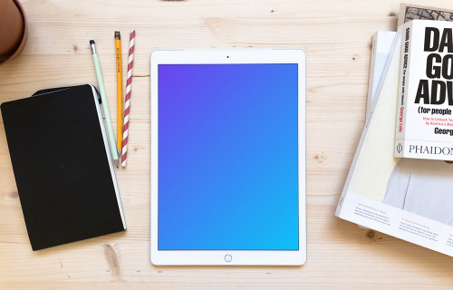 iPad Pro mockup on the wooden working desk