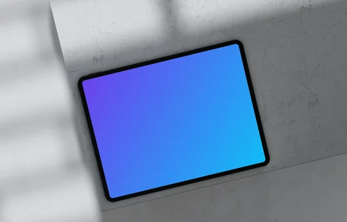 iPad Pro mockup placed on marble surface with shadows