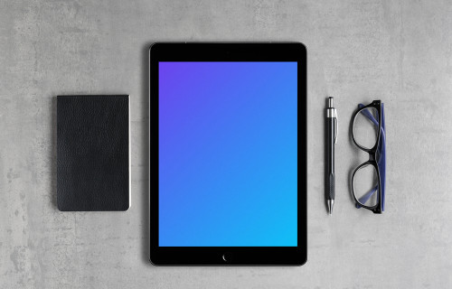 iPad Pro mockup with a journal on the side