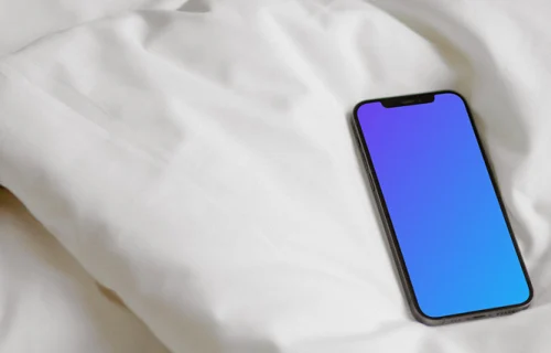 iPhone 12 Pro mockup on a bed