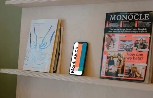 iPhone 13 mockup on bookshelf