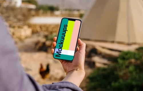 iPhone 13 Pro mockup held by a user