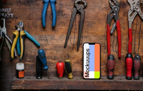 iPhone 13 Pro mockup placed next to a couple of tools