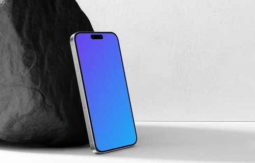 iPhone 15 Pro Leaning Against a Rock Mockup