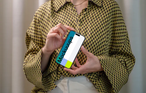 iPhone 15 Pro mockup in a woman's hand with stylish background