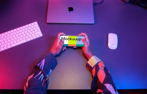 iPhone 15 Pro mockup surrounded by gaming setup