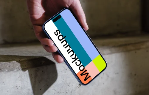 iPhone 16 mockup on concrete stairs