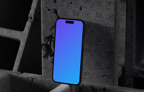 iPhone 16 mockup with concrete backdrop