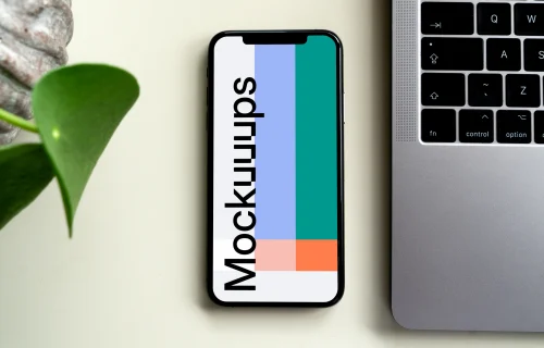 iPhone mockup beside a MacBook