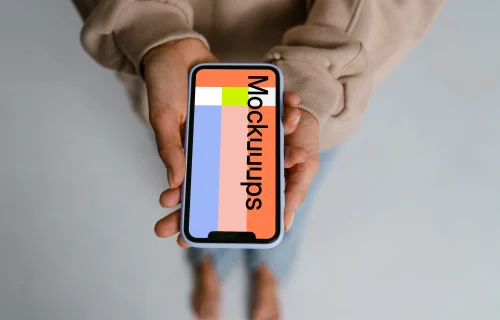 iPhone mockup held with two hands