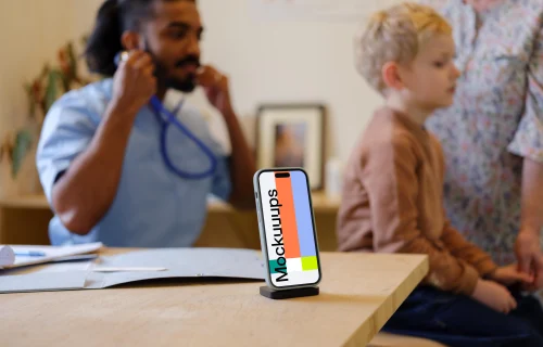 iPhone mockup in the children's doctor's office