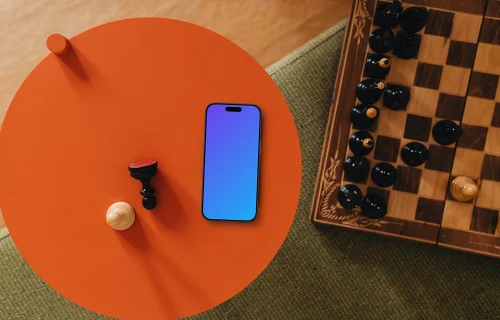 iPhone mockup next to the chess board game
