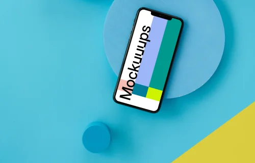 iPhone mockup on a light blue table 