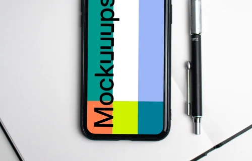 iPhone mockup on a white notebook