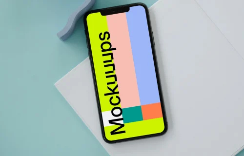 iPhone mockup on a white notepad