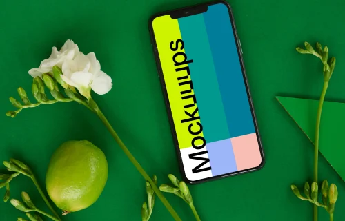 iPhone mockup on green table