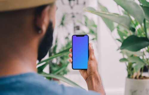 iPhone mockup with flowers in the background