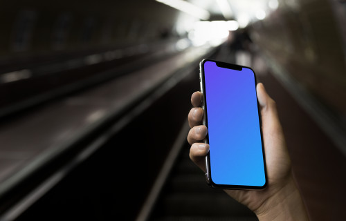 iPhone X mockup in front of underground Entrance
