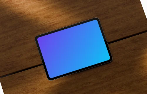 Landscape iPad Pro mockup on a wooden table