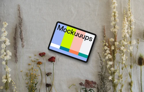 Landscape tablet mockup next to flowers