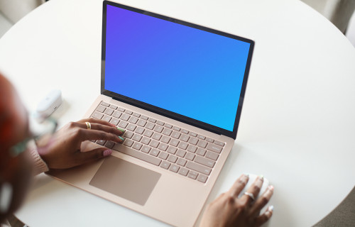 Laptop Mockup of a Young Woman Using a Surface Laptop
