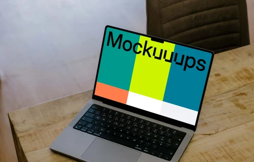 Laptop mockup on the wooden table