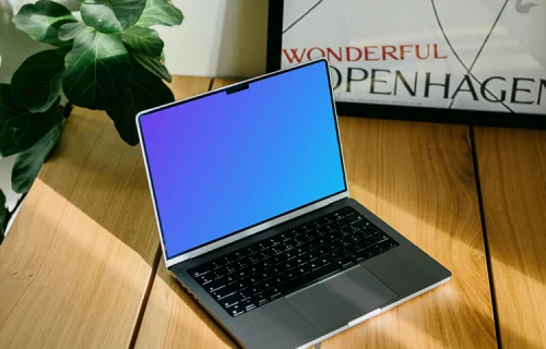 Laptop mockup with a plant in the background