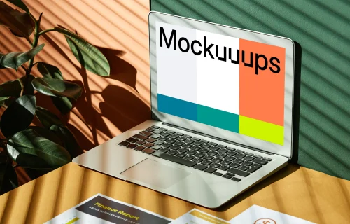 MacBook Air mockup beside a plant