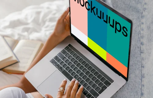 MacBook Air mockup used in bed by a lady