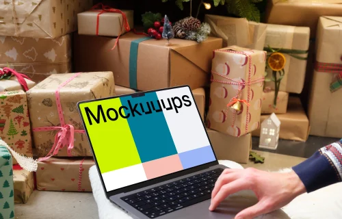 MacBook mockup next to the Christmas tree and gifts