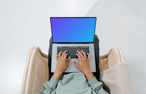 MacBook mockup on a user's laps