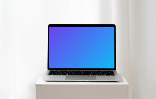 MacBook mockup on a white table in an all white background