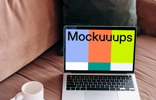 MacBook Pro mockup beside a coffee mug