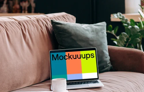 MacBook Pro mockup on a red sofa