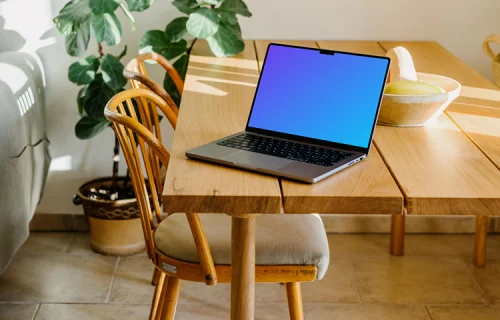 MacBook Pro Mockup on a wooden dining table