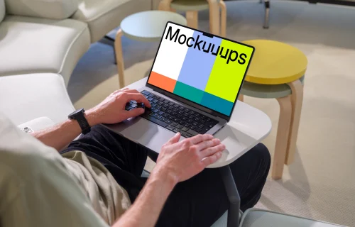 MacBook Pro mockup with a man in a casual workspace