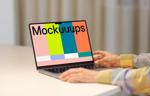MacBook Pro Mockup with Female Hand on a Modern Desk