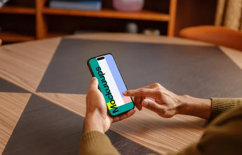 Male hand scrolling on the iPhone mockup