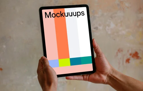 Male hands holding iPad Air mockup