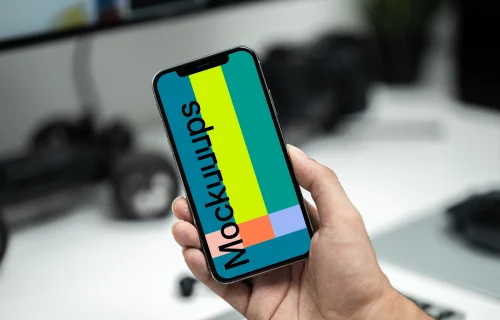 Man holding up an iPhone 12 mockup