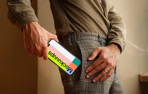 Man putting out of his pocket a iPhone mockup